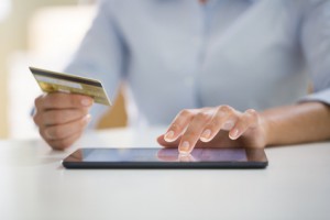 Woman is shopping online with tablet pc